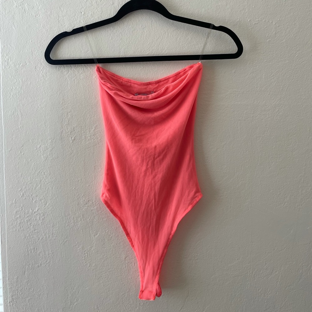 Vibrant orange/pink body suit